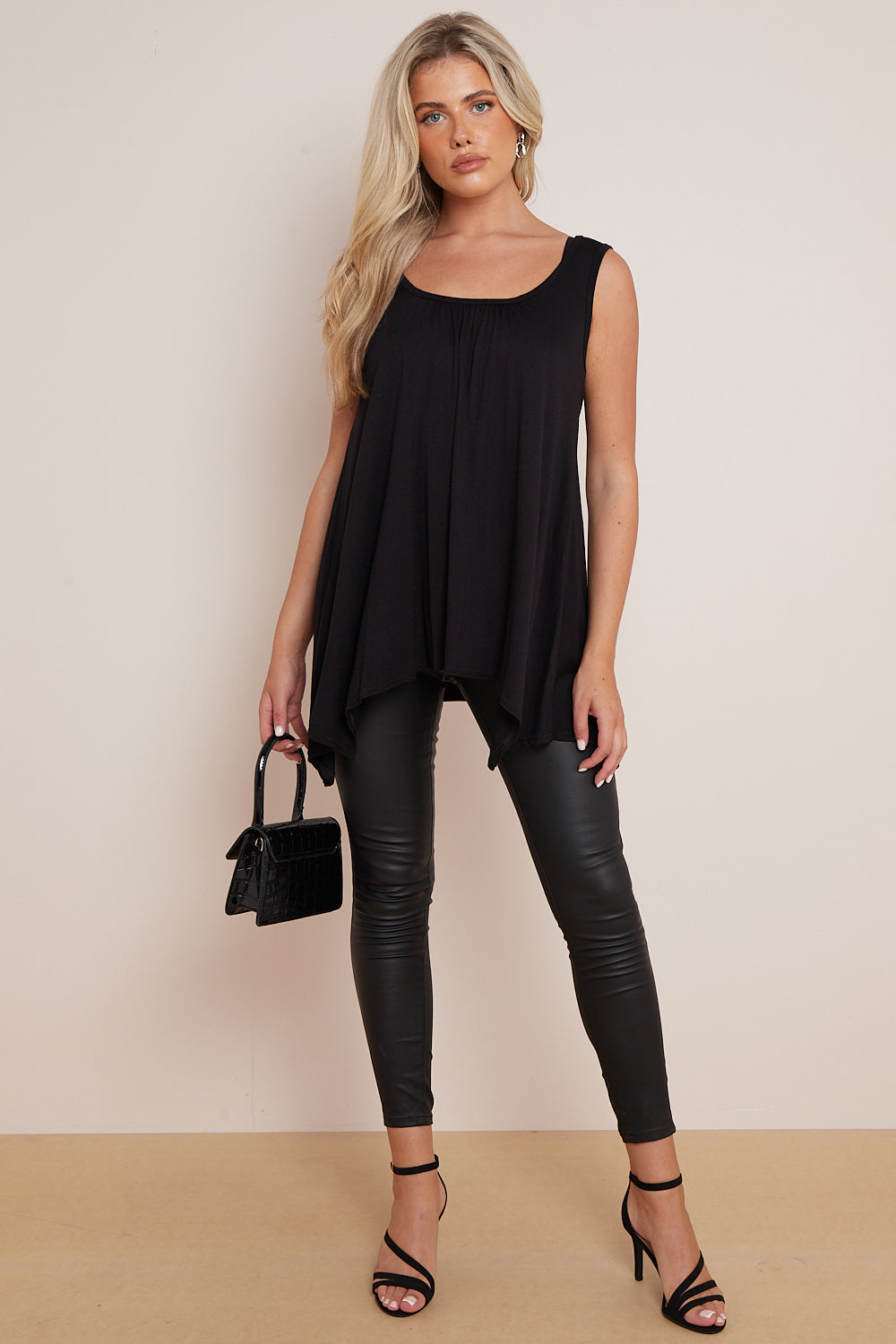 Black Sleeveless Top With Asymmetric Hem